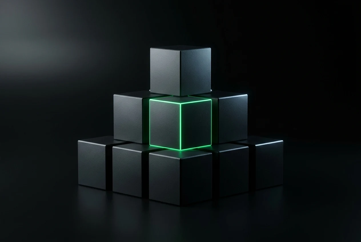 A stack of dark building blocks, one edge lit green